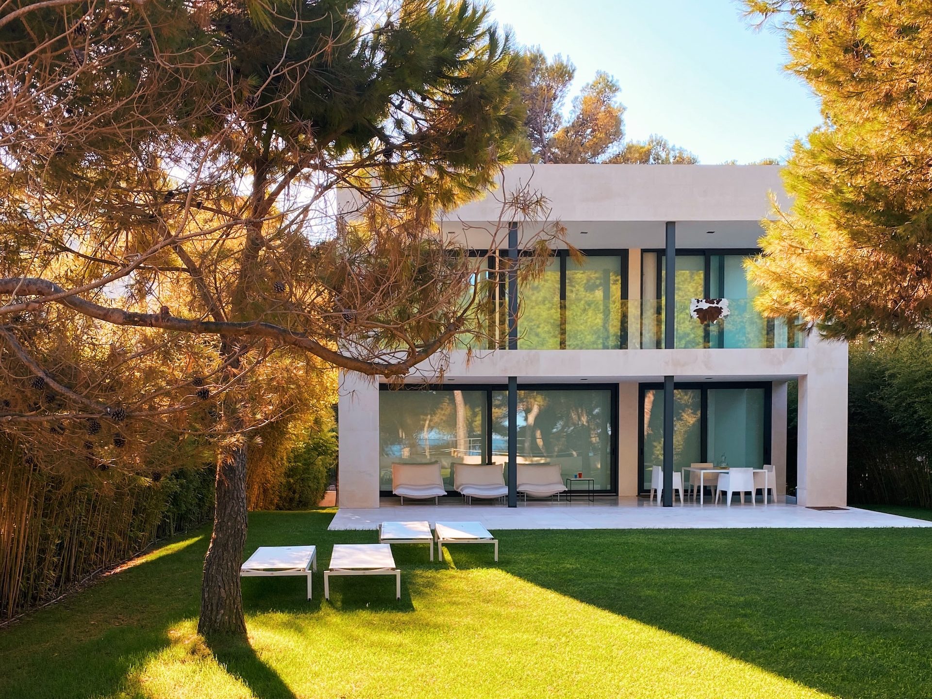 white and brown concrete building near green grass field during daytime